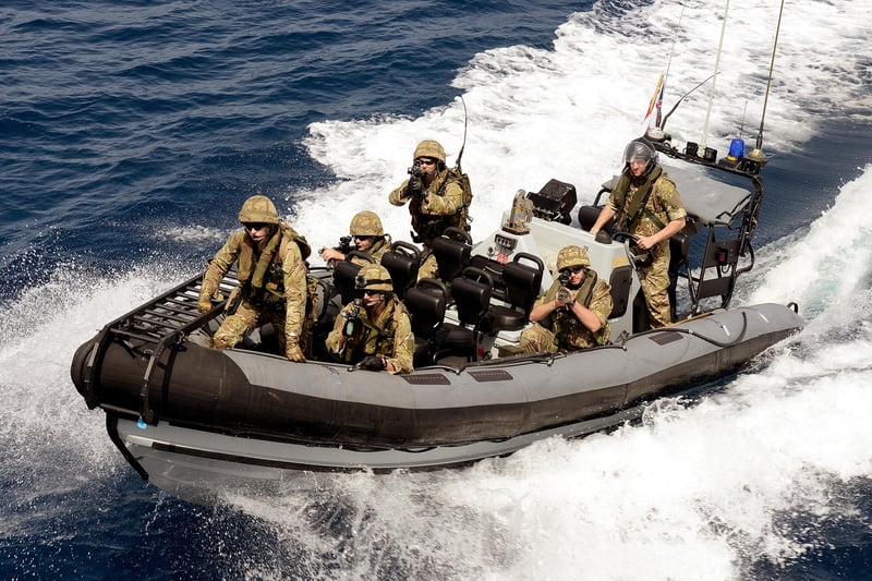 September 2013. One of HMS Dragon's boarding teams conducts live firings from the ship's sea boat in an exercise.