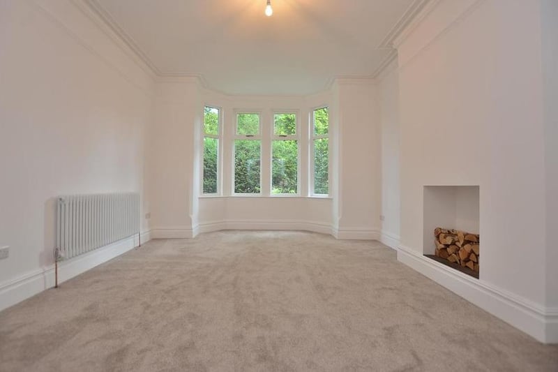 The first of the bay-fronted reception rooms. Features include a new, carpeted floor, a chimney stack with decorative, plastered alcove and deep coving to the ceiling.