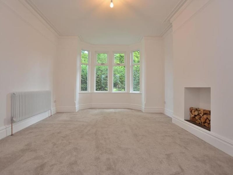 The first of the bay-fronted reception rooms. Features include a new, carpeted floor, a chimney stack with decorative, plastered alcove and deep coving to the ceiling.