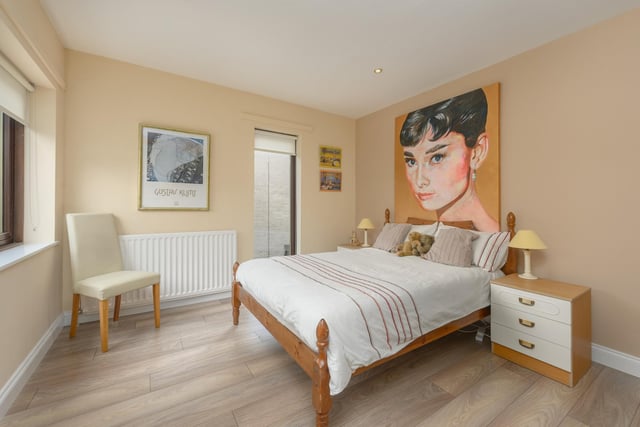 One of four bedrooms, currently featuring Audrey Hepburn artwork.