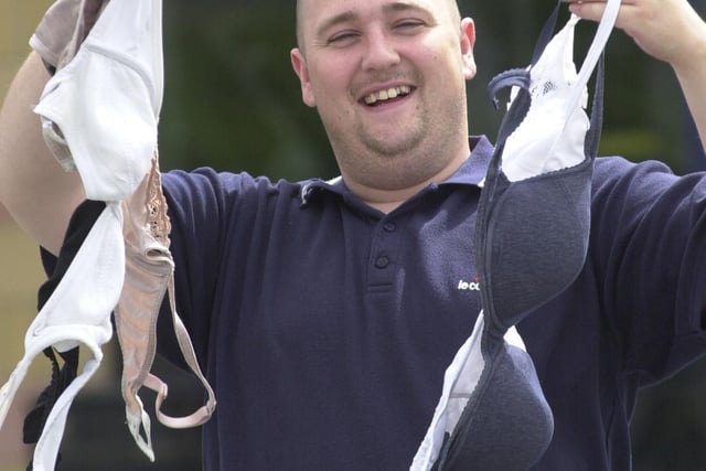Manager Andy Flanagan with bras left behind at Brannigans bar at Valley Centertainment in July 2003