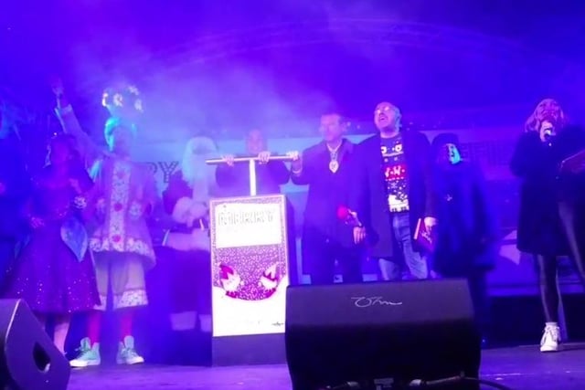 England star Ellie Roebuck pushes the plunger to turn on the Christmas lights