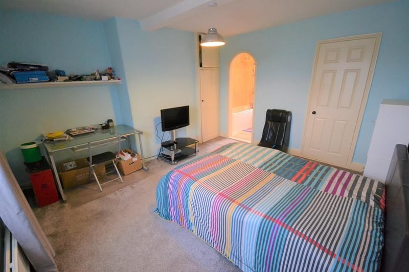 A generous sized front facing double bedroom with  two useful storage cupboards and access to the ensuite.