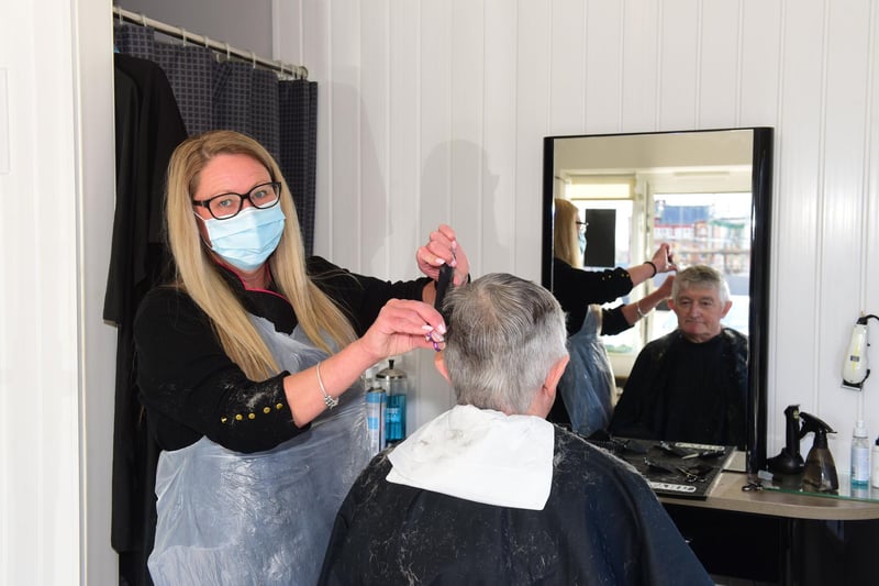 Sharon Pittock cutting the hair of Michael Renshaw on Monday.