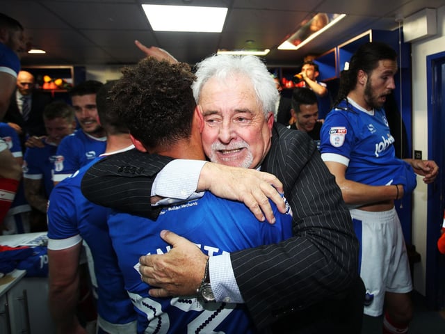 Ian McInnes and Kyle Bennett hug in celebration.