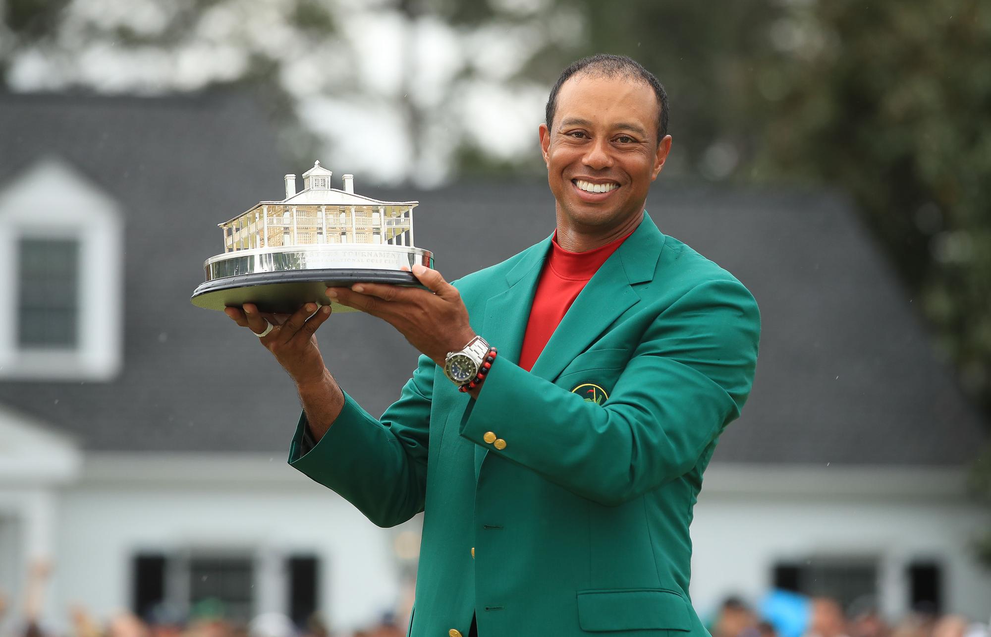 Tiger Woods celebrates with the Masters trophy during the Green Jacket ceremony after his stunning victory at Augusta National last year.