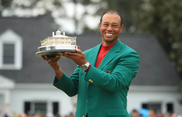 Tiger Woods celebrates with the Masters trophy during the Green Jacket ceremony after his stunning victory at Augusta National last year.