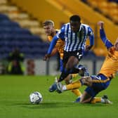 Sheffield Wednesday midfielder Fisayo Dele-Bashiru makes a run through Mansfield Town's midfield.