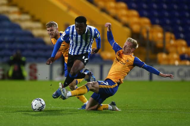 Sheffield Wednesday midfielder Fisayo Dele-Bashiru makes a run through Mansfield Town's midfield.