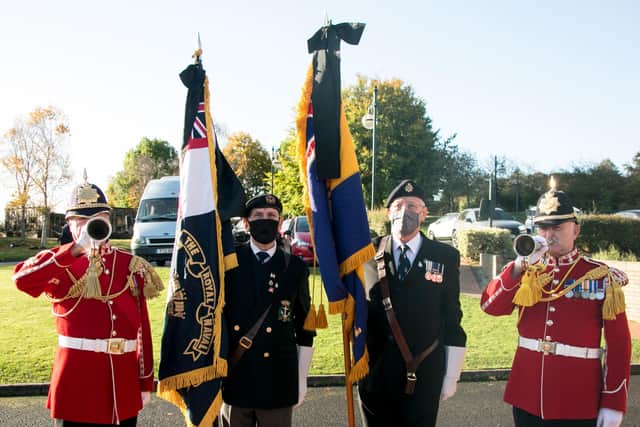 Buglers David Barlow and Andy Page from Yorkshire Volunteers corps of Drums, with Royal British Legion Standard Bearers