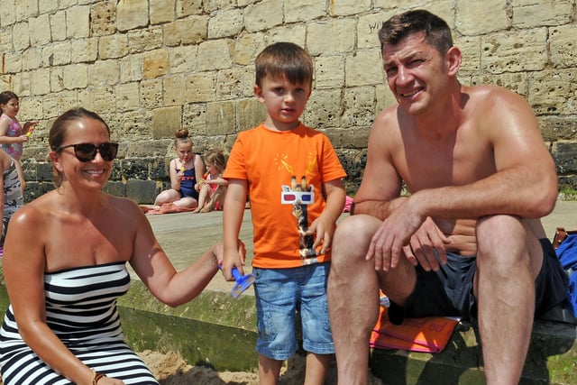 Stephanie Smith, Harvey and Spencer Lowe are pictured enjoying the Summer heatwave at the Fish Sands seven years ago.