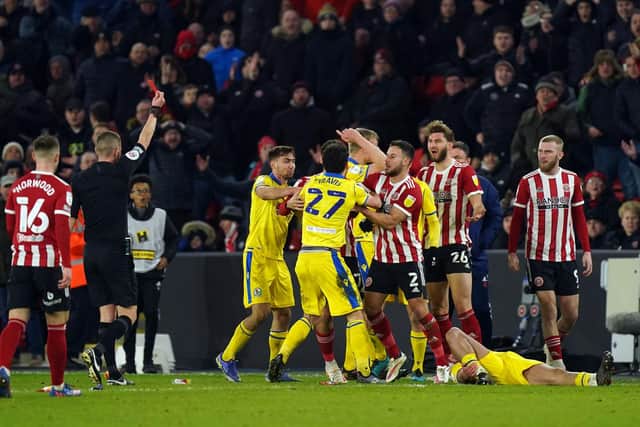 Sheffield United's Charlie Goode (26) is shown a red card by referee Matthew Donohue during the Sky Bet Championship match against Blackburn Rovers: Mike Egerton/PA Wire.