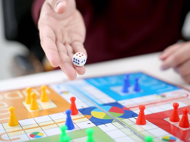 Race around the board with two to four players. You can also play Frustration, a similar game.