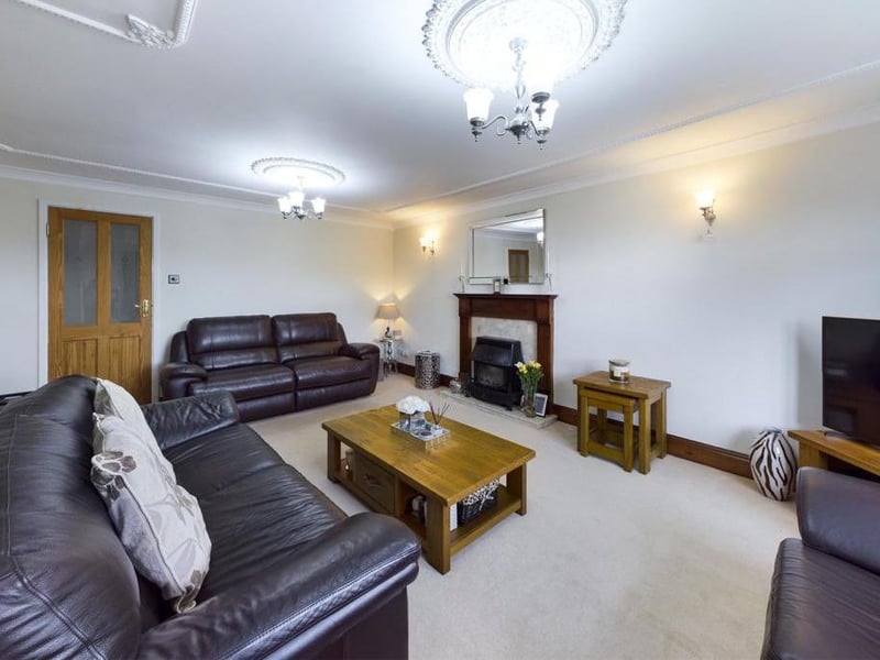 Lounge - uPVC double glazed bow window to the front elevation, ceiling coving, feature fire surround with granite inset and hearth incorporating the outset gas fire, two wall light points, T.V point, two radiator panels and power points.