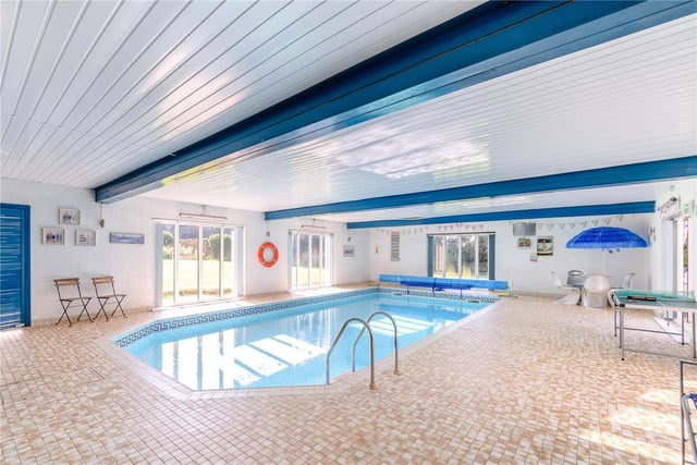 Also on the ground floor of the house is this 13.6m swimming pool, which comes complete with a changing room and double doors which open out onto the garden.