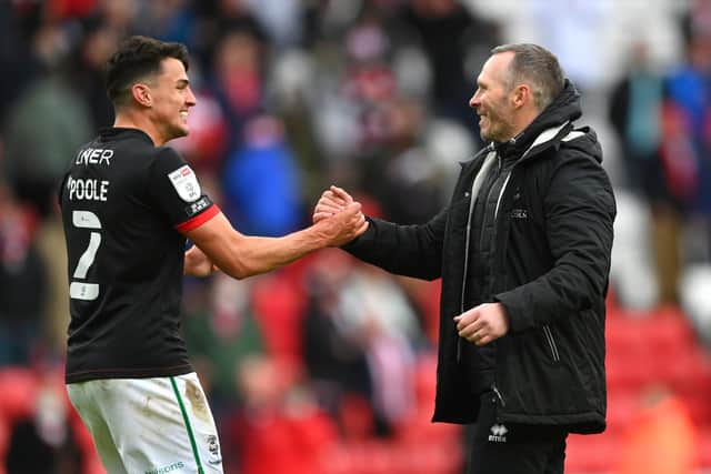 SUNDERLAND, ENGLAND - MAY 22: Michael Appleton Manager of Lincoln congratulates Regan Poole (l) after the Sky Bet League One Play-off Semi Final 2nd Leg match between Sunderland and Lincoln City at Stadium of Light on May 22, 2021 in Sunderland, England. (Photo by Stu Forster/Getty Images)
