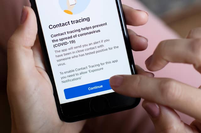 The government's Test and Trace app is displayed on a handheld device (Photo by Dan Kitwood/Getty Images)