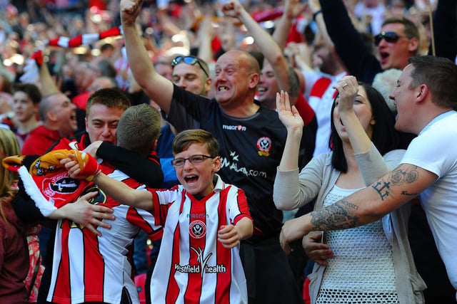 Sheffield United fans celebrate as Jose Baxter scores their first goal during the FA Cup semi-final match between Hull City and Sheffield United at Wembley Stadium on April 13, 2014.  (Photo by Laurence Griffiths/Getty Images)