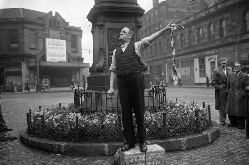 Another picture taken at the famous statue of Queen Victoria - this time of local character Paddy Fagan campaigning for the 1955 general election with the slogan 'Vote for Hoy our boy'.