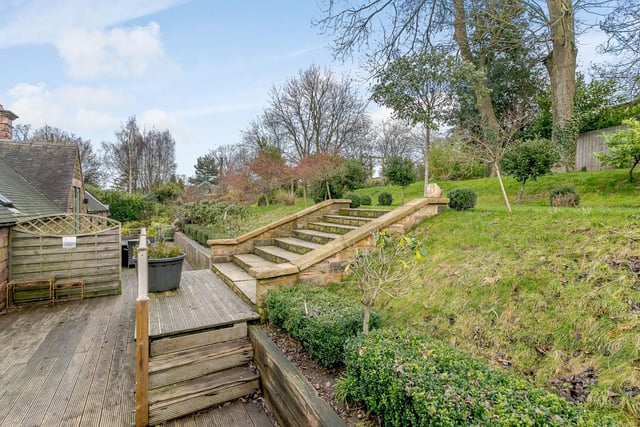 To the rear, the property boasts a large planted tiered garden with many features, including secret gardens, decked areas, planted borders, flowerbeds, shrubs, lawned areas, seating areas.