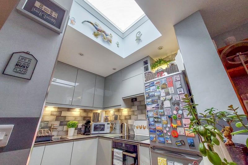 The fitted kitchen has a range of appliance and the overhead window gives great natural light.