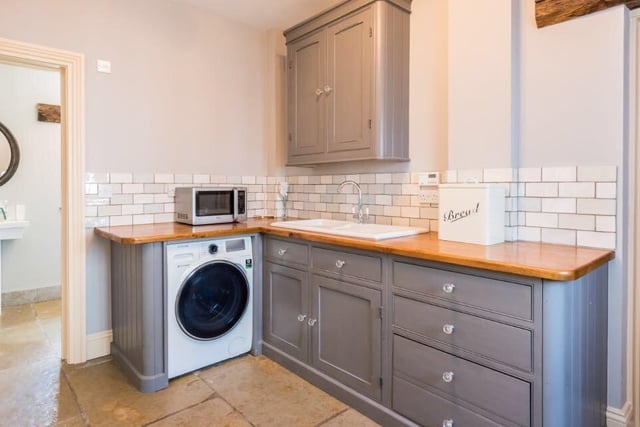The utility room provides some additional storage space to avoid clutter, and is adjacent to the downstairs bathroom, which comprises a toilet and stand-in shower.