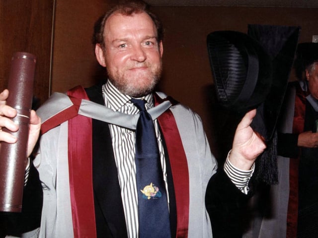 Singer Joe Cocker pictured backstage at Sheffield City Hall after receiving his honorary degree from Sheffield Hallam University. Another recipient, Labour Party politician Roy Hattersley, can be seen in the background