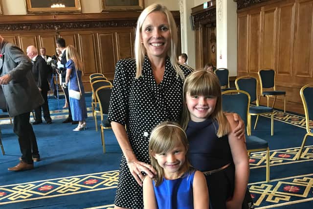 Helen with her two daughters, Annalise, eight and Kairen, five.
