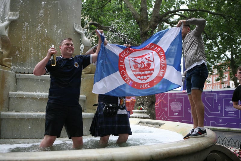 Scotland fans in Leicester Square, London, ahead of the UEFA Euro 2020 Group D match between England and Scotland at Wembley Stadium.