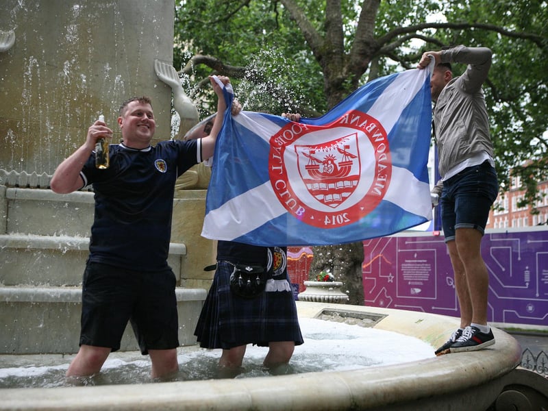 Scotland fans in Leicester Square, London, ahead of the UEFA Euro 2020 Group D match between England and Scotland at Wembley Stadium.
