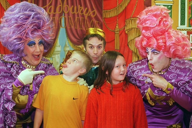 The ugly sisters performed in 1999 for pupils at Ridgeway Primary School in their run up to the panto season at the Lyceum. The sisters, Sharon and Tracey, also known as Peter Robins, left and Nigel Elliot seen here with 10 year olds Matthew Knowles and Joelle Green and Buttons.
