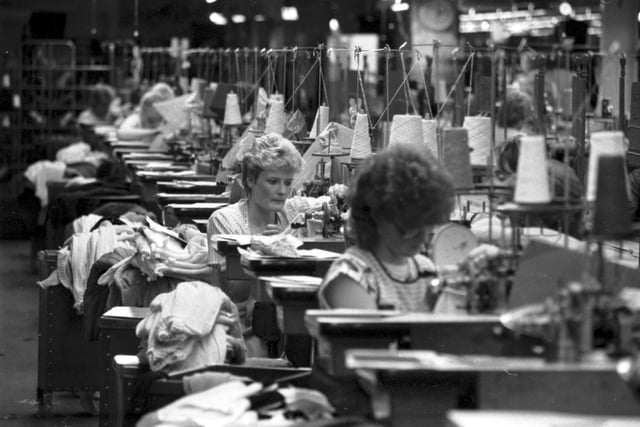 Workers at their sewing machines at the Pringle knitwear factory in Hawick, December 1985.