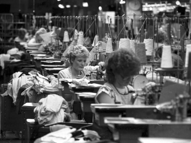 Workers at their sewing machines at the Pringle knitwear factory in Hawick, December 1985.