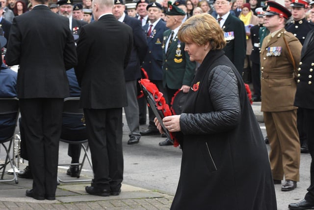 The leader of South Tyneside Council, Cllr Tracey Dixon, walks forward to lay a wreath.