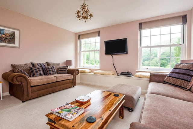 The sitting room has two double glazed sash windows with a full length picture seat beneath which takes advantage of the spectacular views of the dale.
