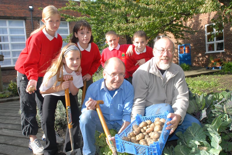 Gardeners David Cape and John Stephenson gave a helping hand to pupils at Bedewell School as they gathered in the Harvest Festival produce in 2006.