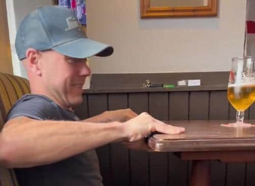 Andrew Butler performing his party trick with a table at The Royal pub in Woodhouse, Sheffield. The video has been viewed 3.3 million times since he shared it on TikTok