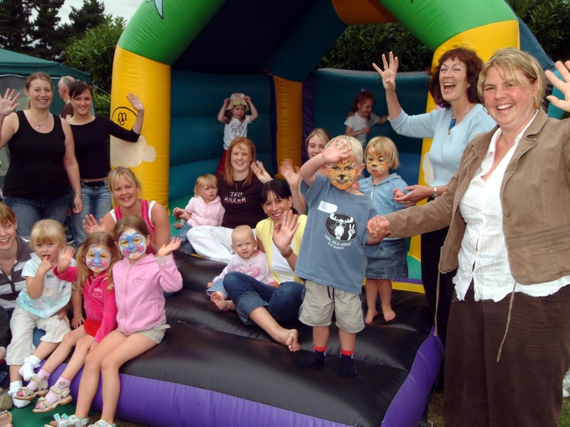 Bright Sparks Nursery held a fundraising afternoon to celebrate receiving an accreditation from the Pre-School Learning Alliance and to raise funds for meningitis charities. Staff and youngsters are pictured with principal Lynne Donovan, second right, and mum Claire Scothern, right, with her son Thomas, 
Claire lost both her legs after contracting septicemia during pregnancy.