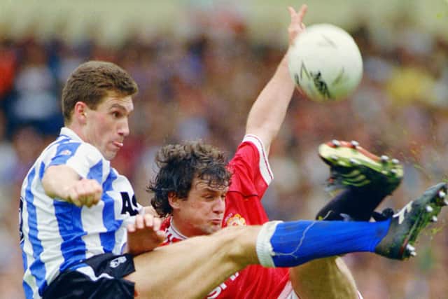 Former Sheffield Wednesday captain Nigel Pearson challenges Mark Hughes of Manchester United during the 1991 League Cup Final.