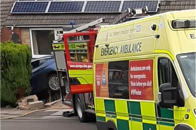 Emergency services are in Dronfield after a car crashed into a house this morning.