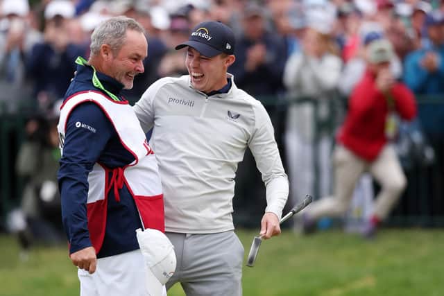 Matt Fitzpatrick celebrates with caddie Billy Foster after winning on the 18th green during the final round of the 122nd U.S. Open Championship at The Country Club on June 19, 2022 in Brookline, Massachusetts. (Photo by Warren Little/Getty Images)