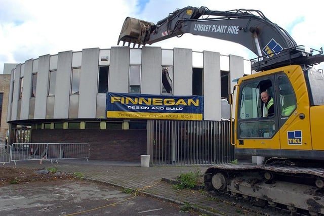 Plant operator Mark Baldock starts the demolition of the Sheffield Registry Office, October 21, 2004