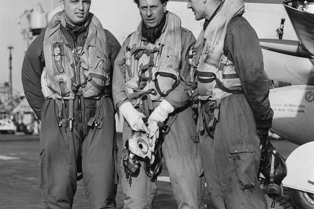 L-R, Lieutenants D Lang, D Price and D Rawbone, pilots of Fleet Air Arm 800 Squadron Supermarine Attacker FB2 fighters after landing on the flight deck of HMS Eagle during exercises in the English Channel on 19 March 1952.