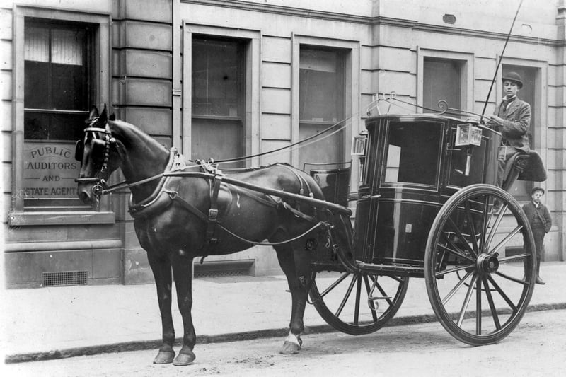 A Hansom cab outside the offices of chartered accountants John Watson and Sons, 11 Leopold Street, c 1900. Ref no Y02566