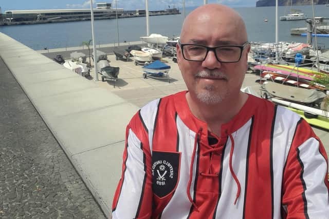 Blades fan and All Saints School teacher, Wayne Chadburn, has promised to wear a Sheffield Wednesday shirt to school for a day if he hits his charity fundraising target. Pictured is Wayne, by the coast wearing a retro Sheffield United shirt.