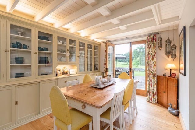 Adjoining the kitchen is a cosy dining area, featuring enough room for both family and guests, with views overlooking the garden.