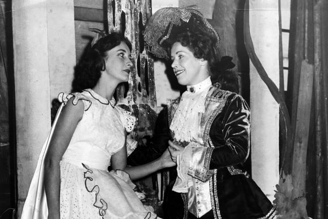 Prince Valiant (Mary Harkness) serenades Red Riding Hood (Barbara Haydn) during the pantomime dress rehearsal at the Sheffield Lyceum Theatre, in December 1955.