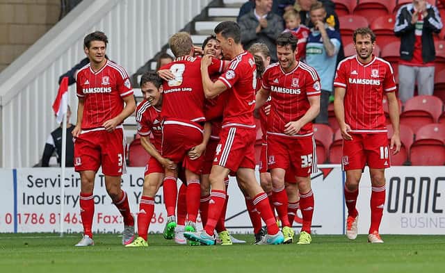 Stewart Downing celebrates with his team-mates after scoring the opening goal against MK Dons.