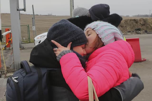 Ukrainian refugees fleeing Russian invasion reunite in Medyka border crossing, Poland, on Wednesday, March 2, 2022. (AP Photo/Visar Kryeziu)