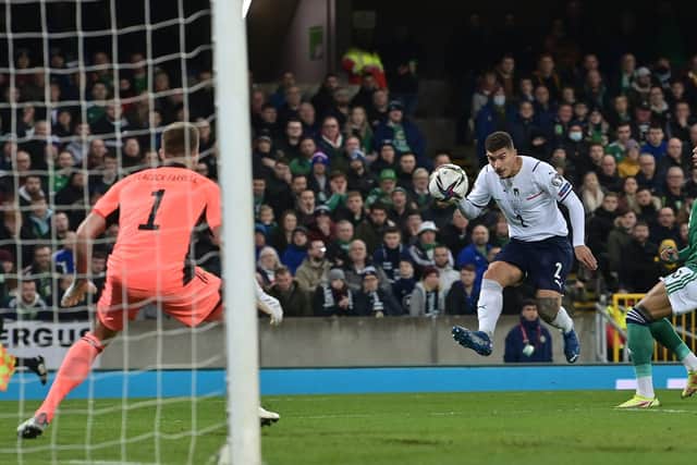 Bailey Peacock Farrell of Northern Ireland saves from Giovanni Di Lorenzo of Italy during the 2022 FIFA World Cup Qualifier match between Northern Ireland and Italy at Windsor Park. (Photo by Charles McQuillan/Getty Images)